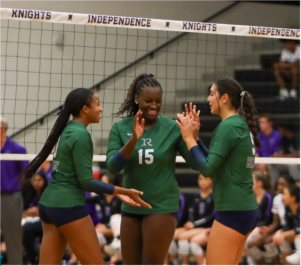 Reedy volleyball girls (left to right) Camryn Corso, Charlie Henderson, and Ciara William celebrating after a big hit. The Reedy volleyball team worked hard during practices to dominate the court. 
